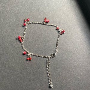 Silver toned bracelet with extender and small red accent beads